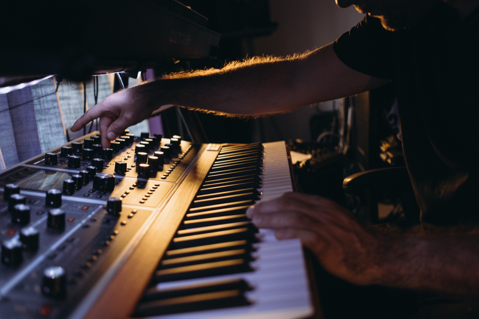 Hands on a synthesizer