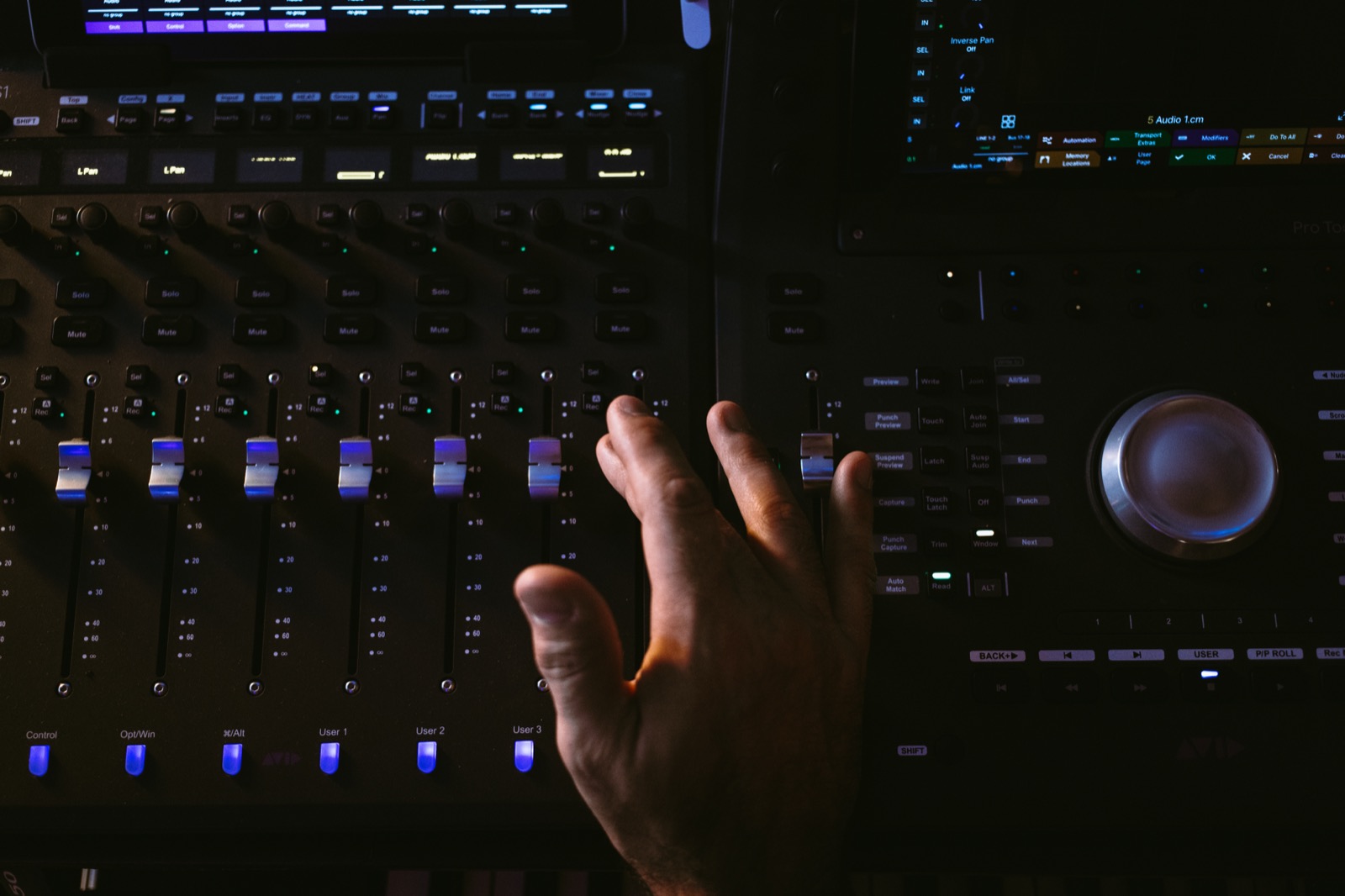 Hand on the mixing console